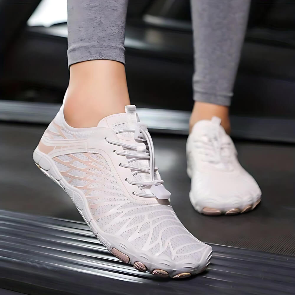Barfußschuhe in Weiß und Rosa mit ergonomischem Design. Perfekt für Fitness, Laufen und Outdoor-Aktivitäten.